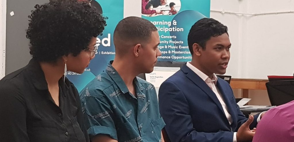 Violinist Sarah Daramy-Williams and composer James B. Wilson listen in to composer Michael Rakotoarivony at the Q&A after Chineke!'s Malcolm X Centre, Bristol performance - May 18, 2019.